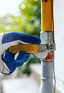 Hand Closes The Household Gas Pipe Valve